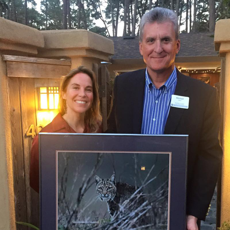 Camilla Fox presents Michael Sutton with Project Coyote's Wildlife Stewardship of the Year Award
